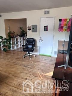 44 Judson Street, Unit 9A Edison, NJ 08837 - Photo 9 of 12 a living room with furniture and a flat screen tv