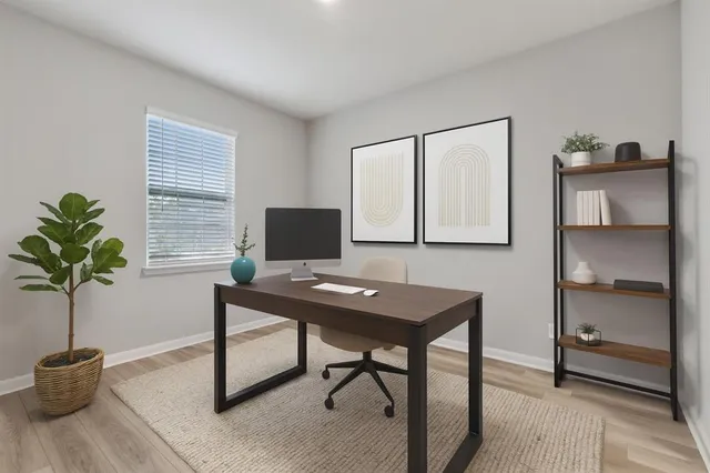 a view of a workspace with furniture