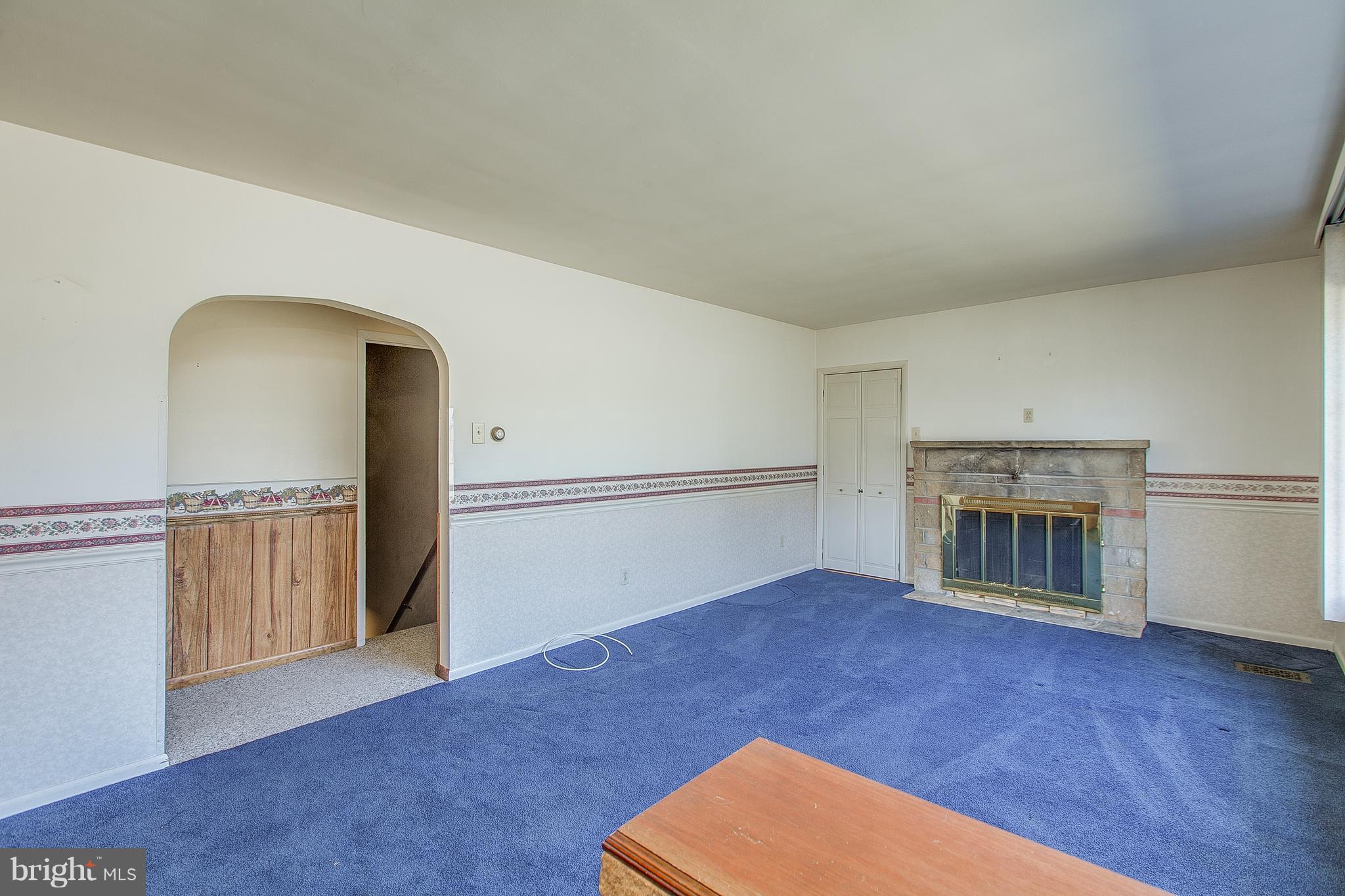 11348 Greenberry Road Hagerstown, MD 21740 - Photo 11 of 30 Living Room with cozy FP & door to Sun Porch