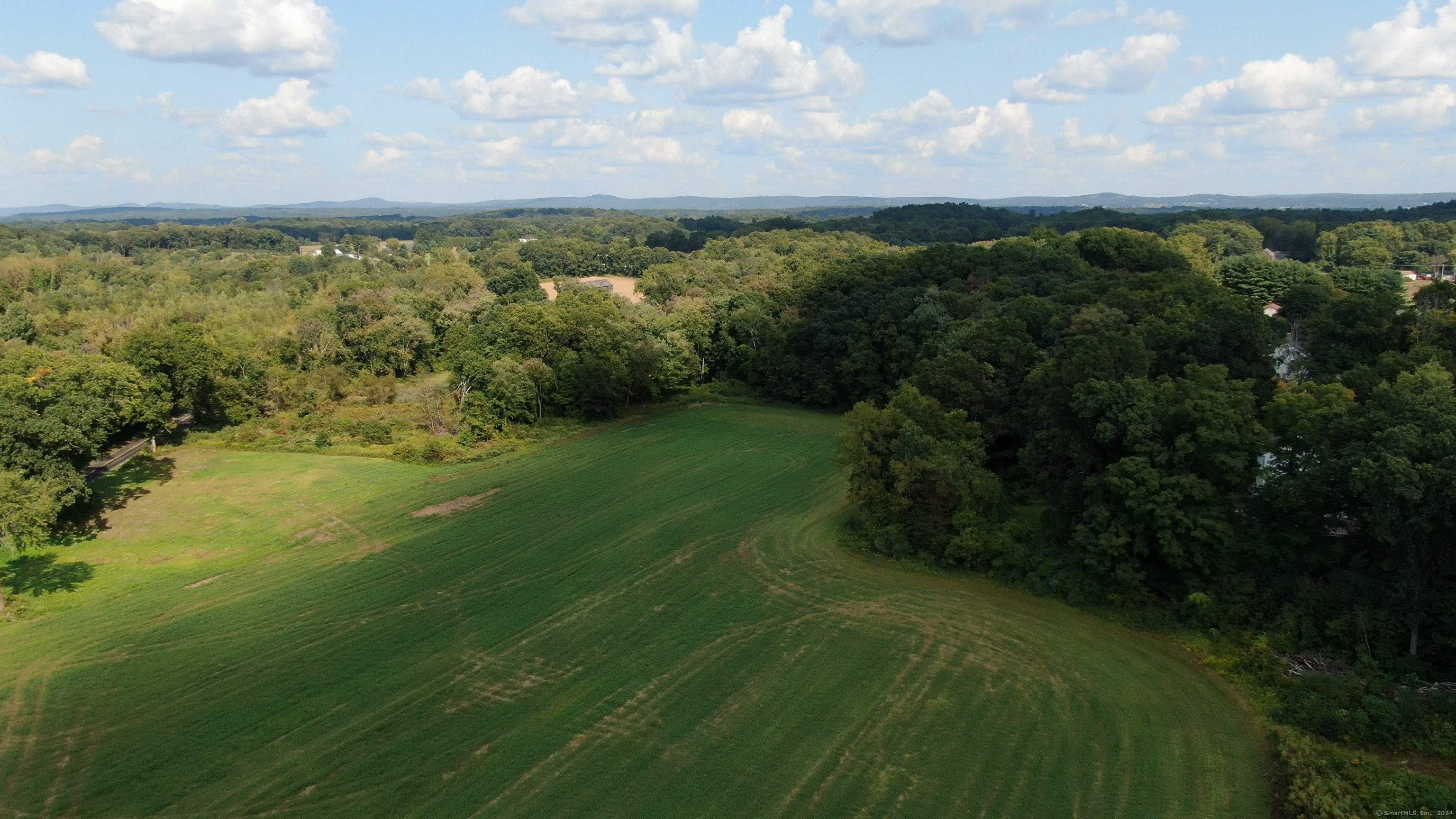 0 Chamberlain Road Broad Brook, CT 06016 - Photo 15 of 16 a view of a lake with a yard