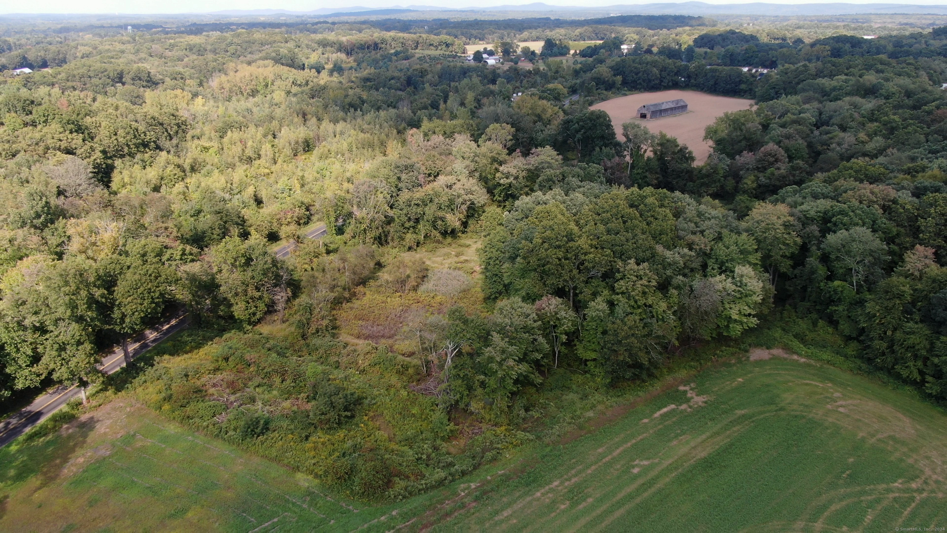 0 Chamberlain Road Broad Brook, CT 06016 - Photo 2 of 16 an aerial view of a house with a yard