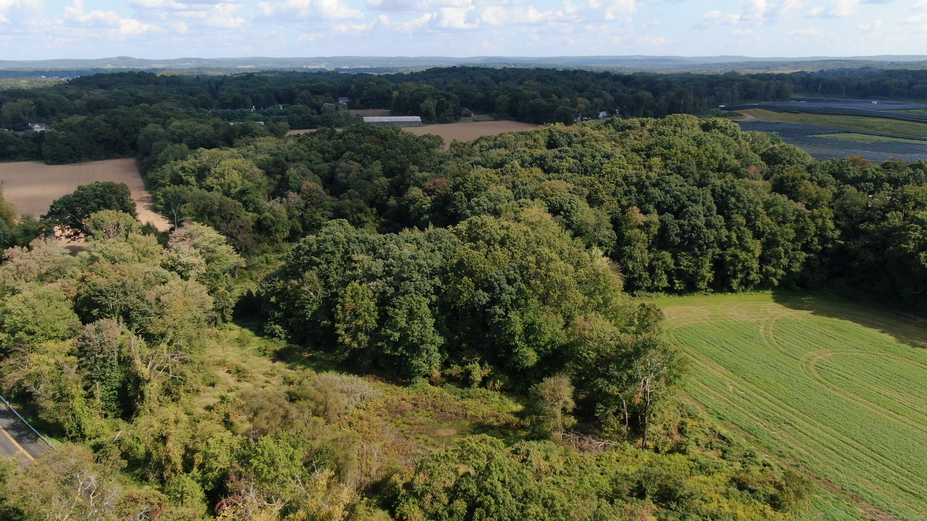 0 Chamberlain Road Broad Brook, CT 06016 - Photo 4 of 16 a view of a lake with a mountain