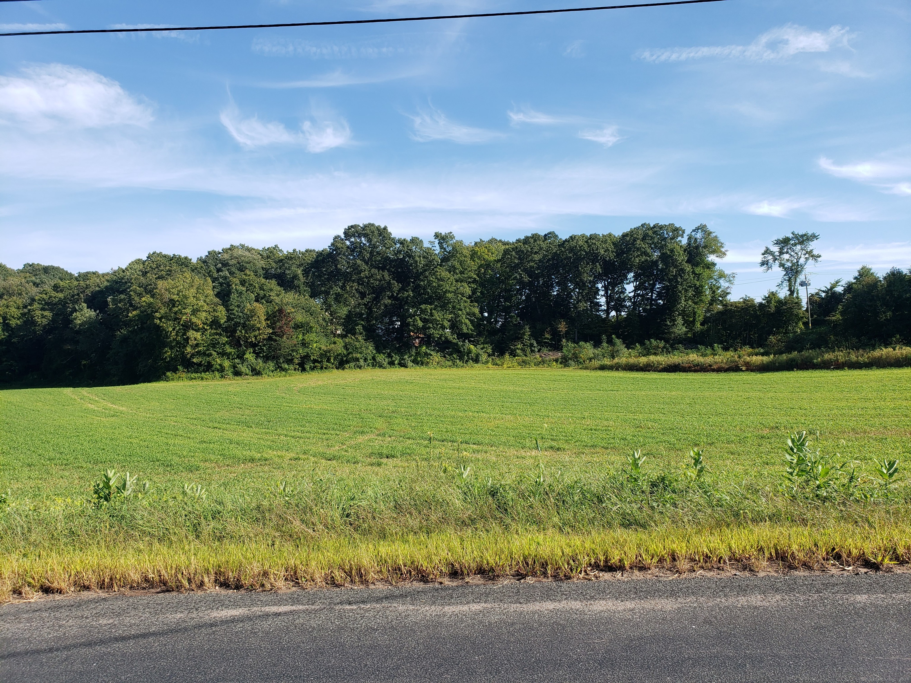 0 Chamberlain Road Broad Brook, CT 06016 - Photo 10 of 16 a view of a golf course with a lake