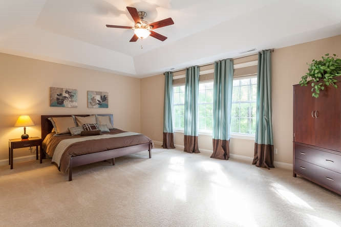 12825 Edsel Drive Raleigh, NC 27613 - Photo 14 of 25 Huge master bedroom with deep tray ceiling and his and hers walk in closets! Master Bedroom