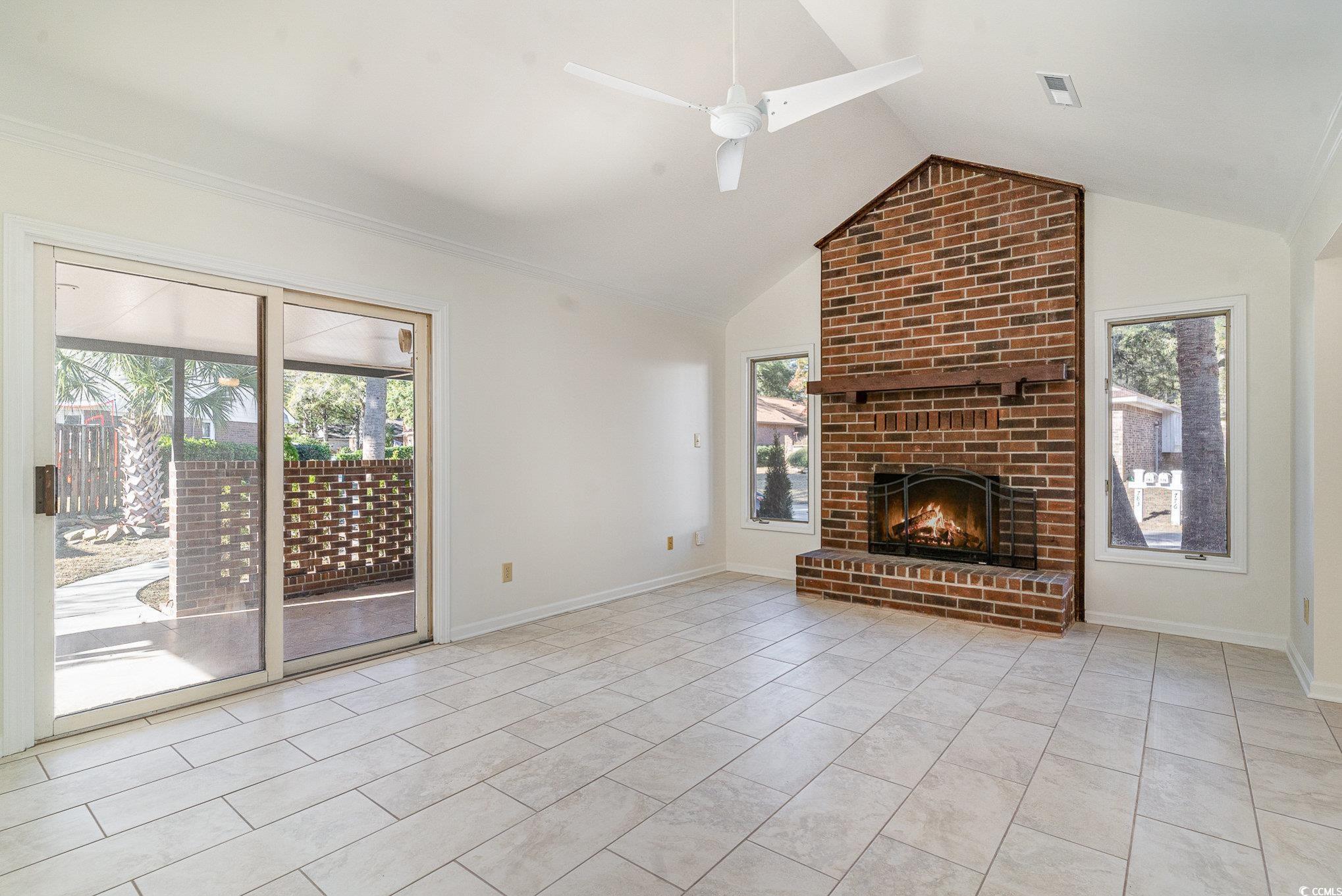 783 Kittiwake Lane Murrells Inlet, SC 29576 - Photo 8 of 21 Unfurnished living room featuring ceiling fan, lig