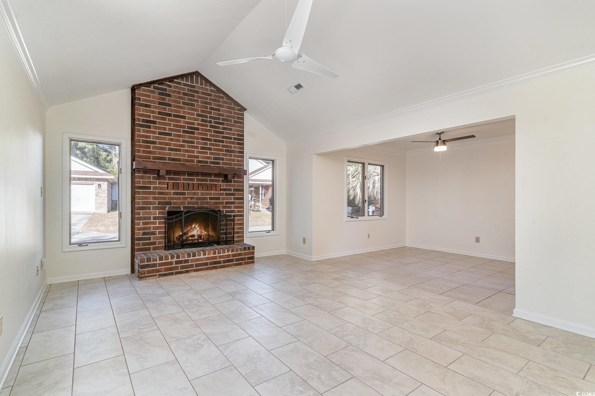 783 Kittiwake Lane Murrells Inlet, SC 29576 - Photo 10 of 21 Unfurnished living room featuring ceiling fan, lig