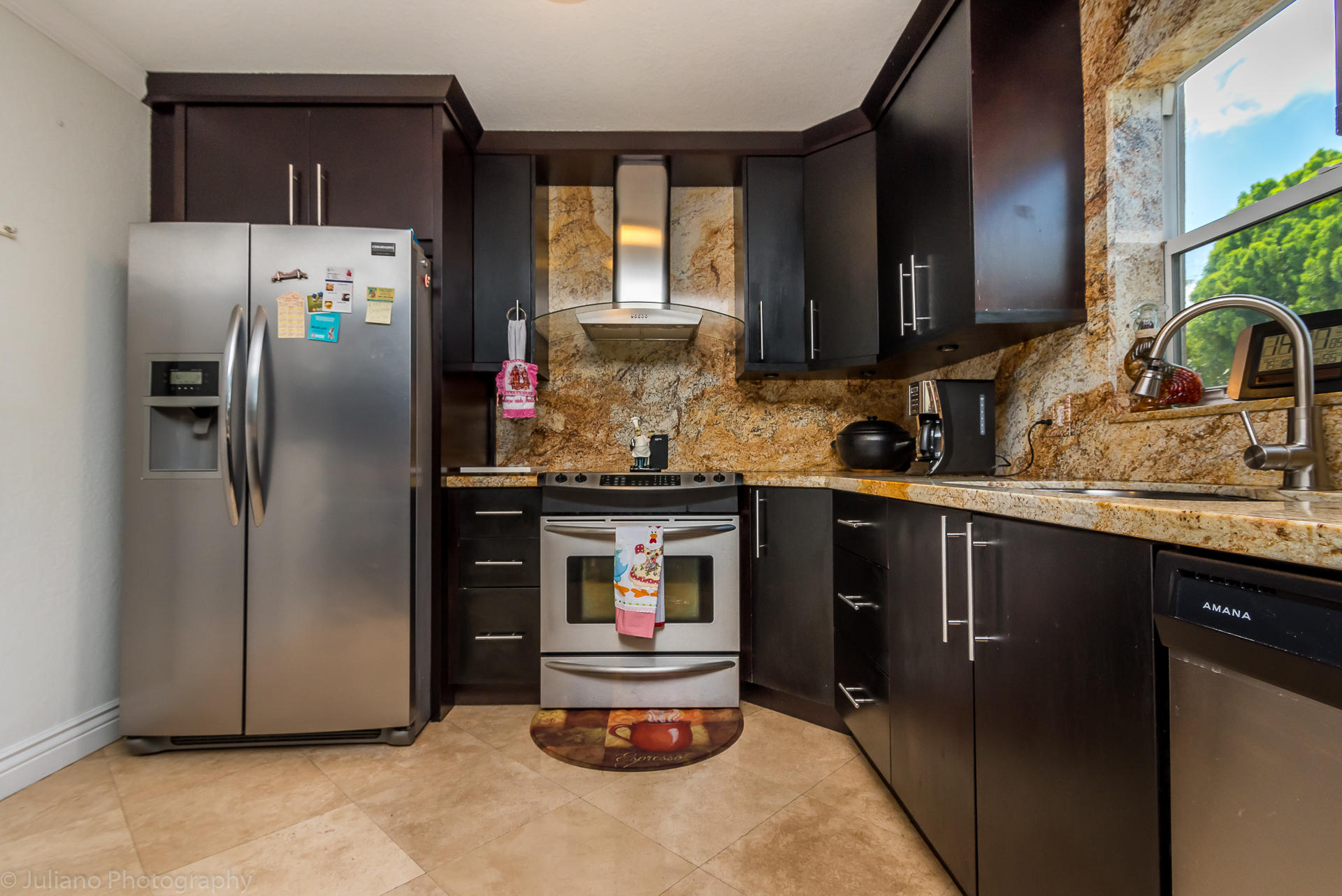 4971 Ataman Street Boca Raton, FL 33428 - Photo 3 of 27 a kitchen with refrigerator and cabinets