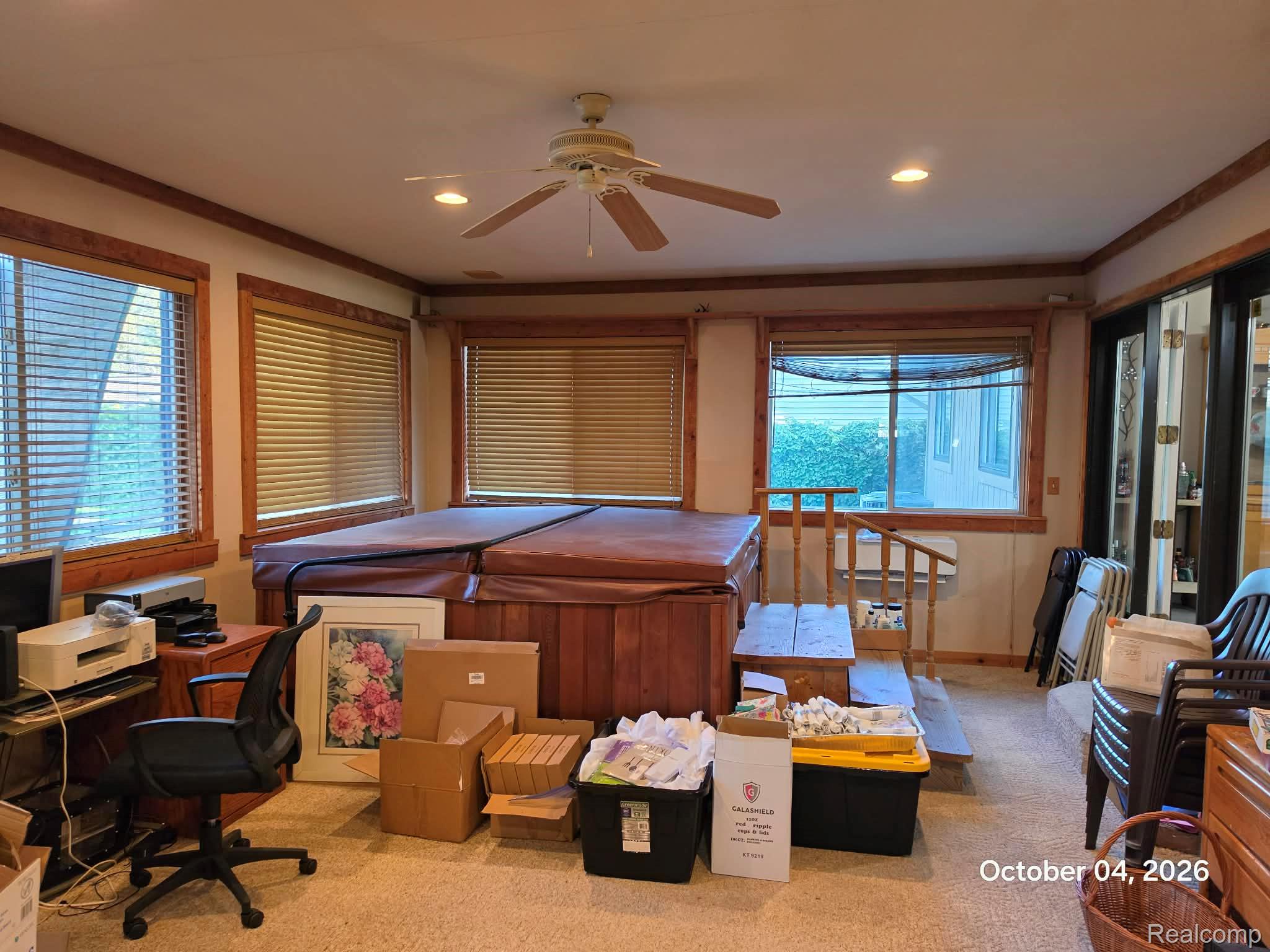 34781 Union Lake Road Clinton Township, MI 48035 - Photo 14 of 38 Indoor spa with wood-finish surround, multiple windows with blinds, recessed lighting, and a ceiling fan