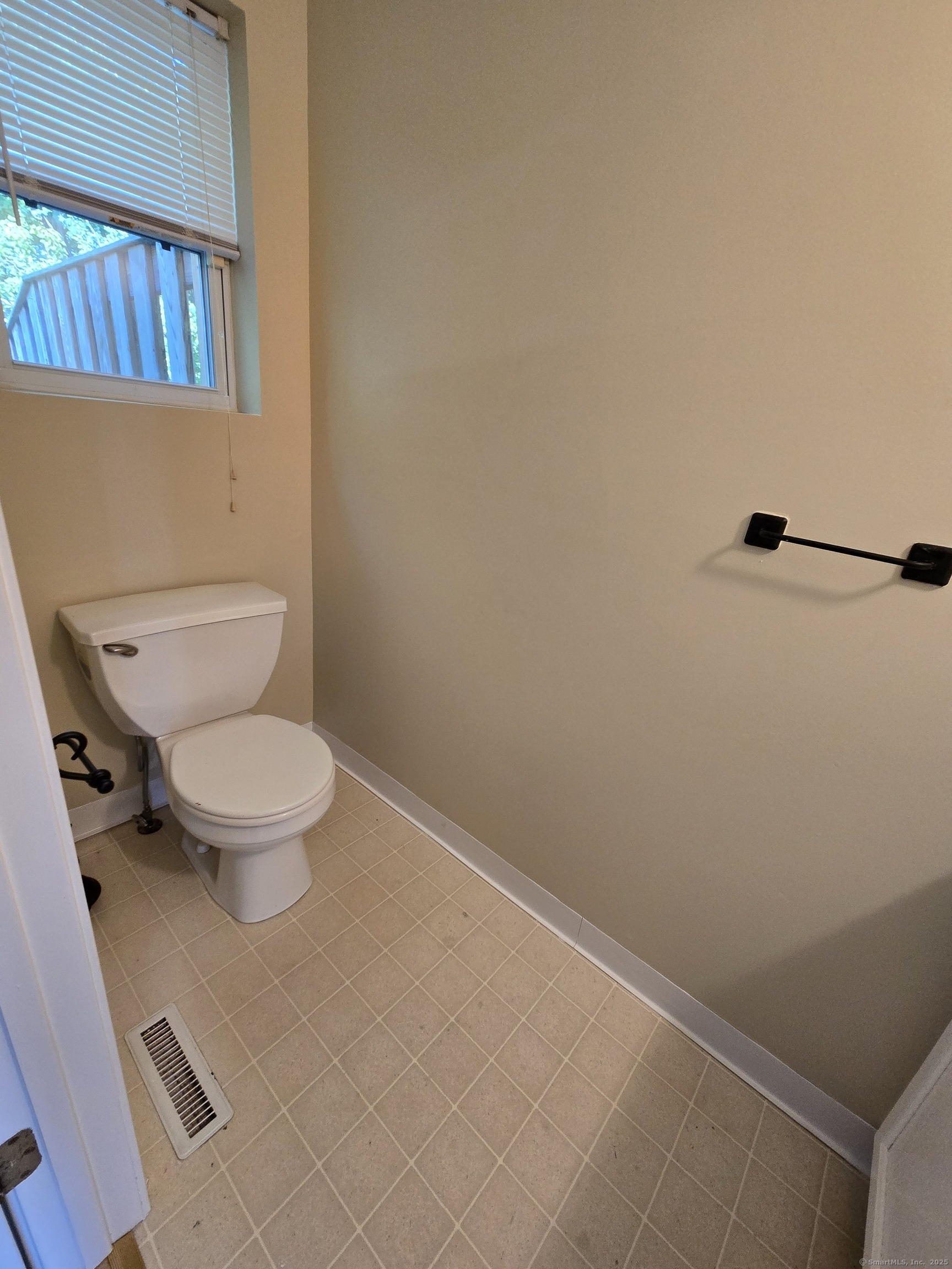 5 Periwinkle Lane, Unit 5 Glastonbury, CT 06033 - Photo 12 of 23 a white toilet sitting next to a shower