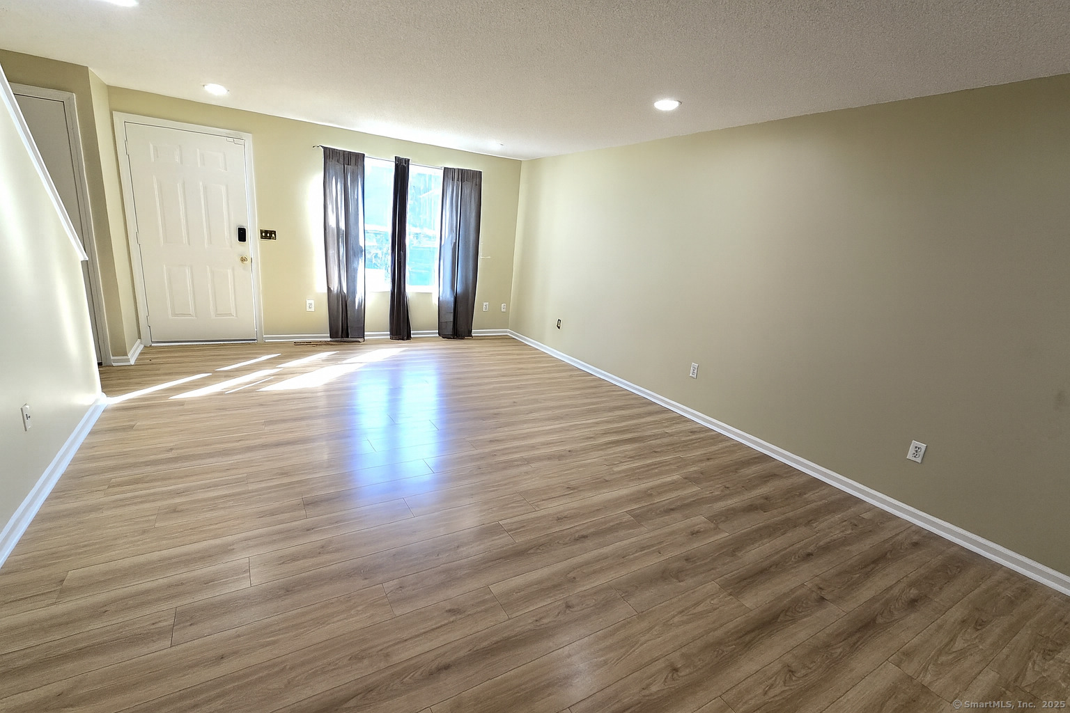 5 Periwinkle Lane, Unit 5 Glastonbury, CT 06033 - Photo 6 of 23 wooden floor in an empty room with a window