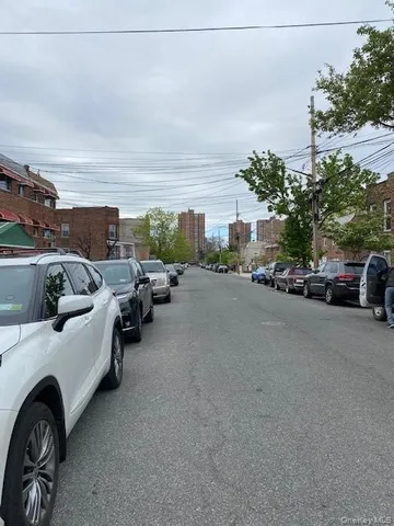 a view of a cars park in front of a house