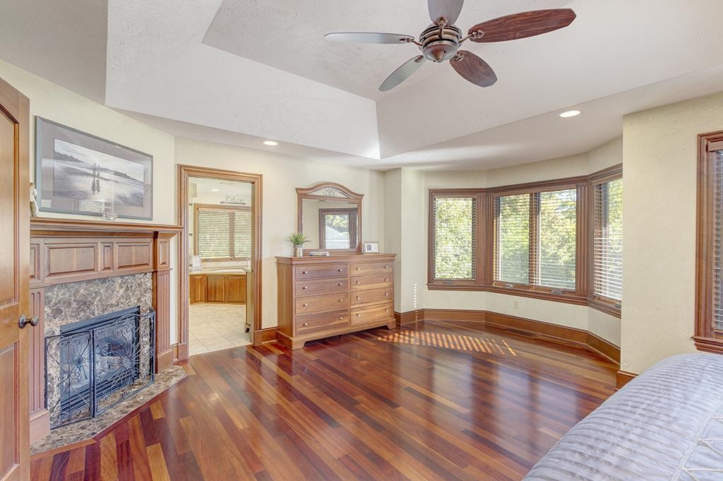 7417 Winding Way Roscoe, IL 61073 - Photo 16 of 40 a view of an empty room with wooden floor and a window