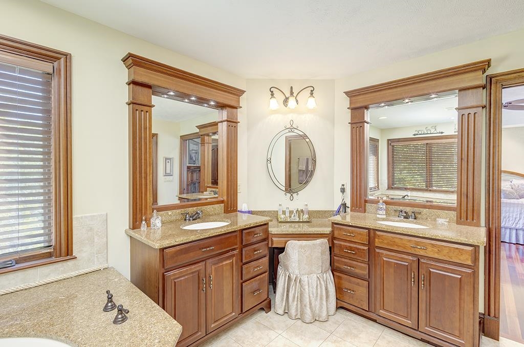 7417 Winding Way Roscoe, IL 61073 - Photo 19 of 40 a bathroom with a sink vanity and mirror