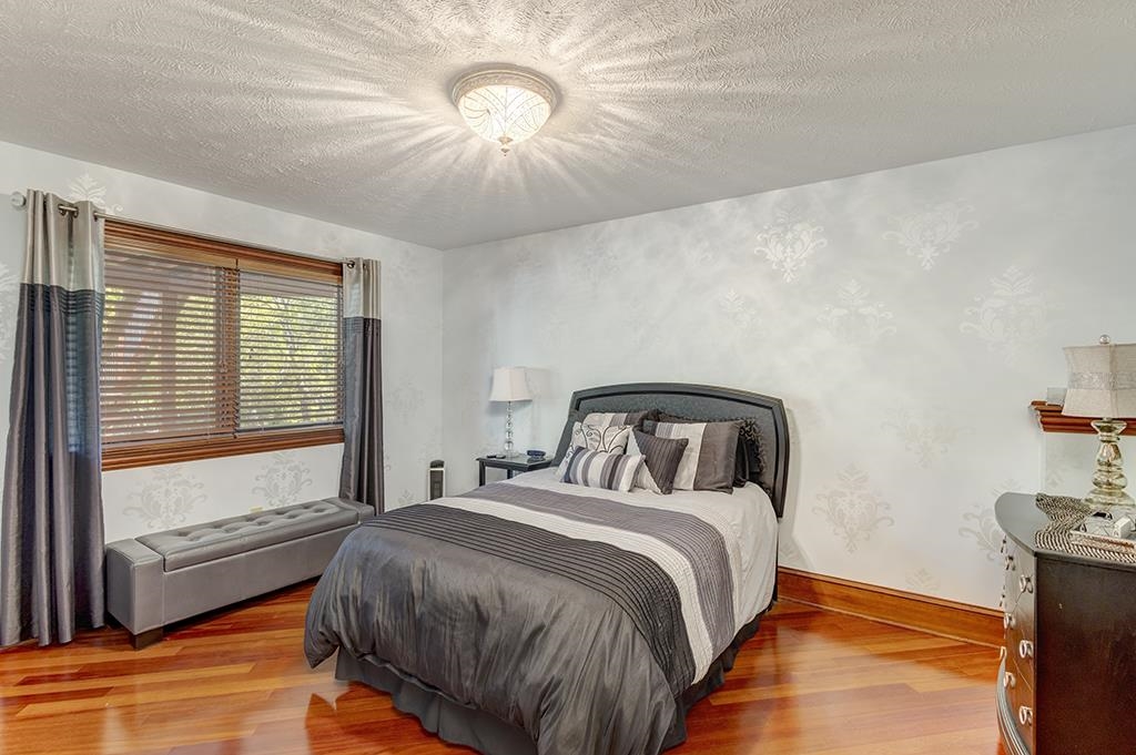 7417 Winding Way Roscoe, IL 61073 - Photo 20 of 40 a bed sitting in a bedroom next to a window