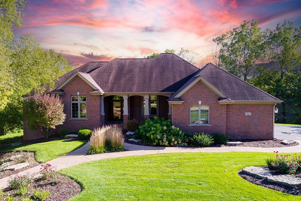 7417 Winding Way Roscoe, IL 61073 - Photo 2 of 40 a front view of house with yard and green space