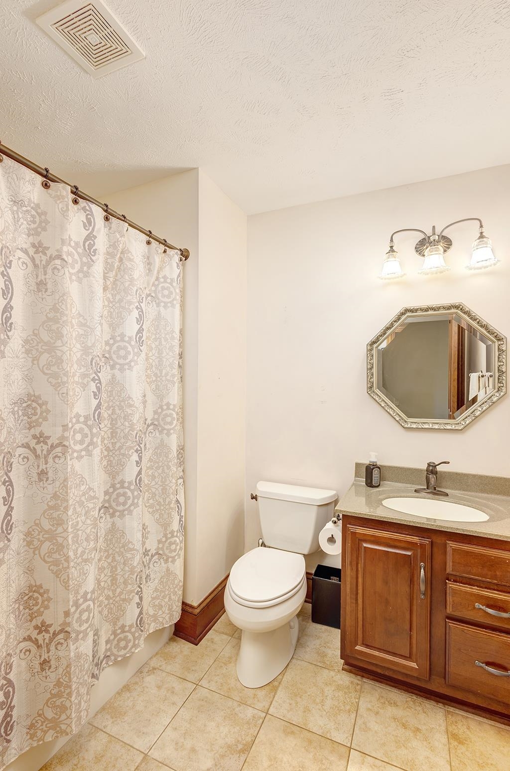7417 Winding Way Roscoe, IL 61073 - Photo 21 of 40 a bathroom with a granite countertop toilet sink and mirror