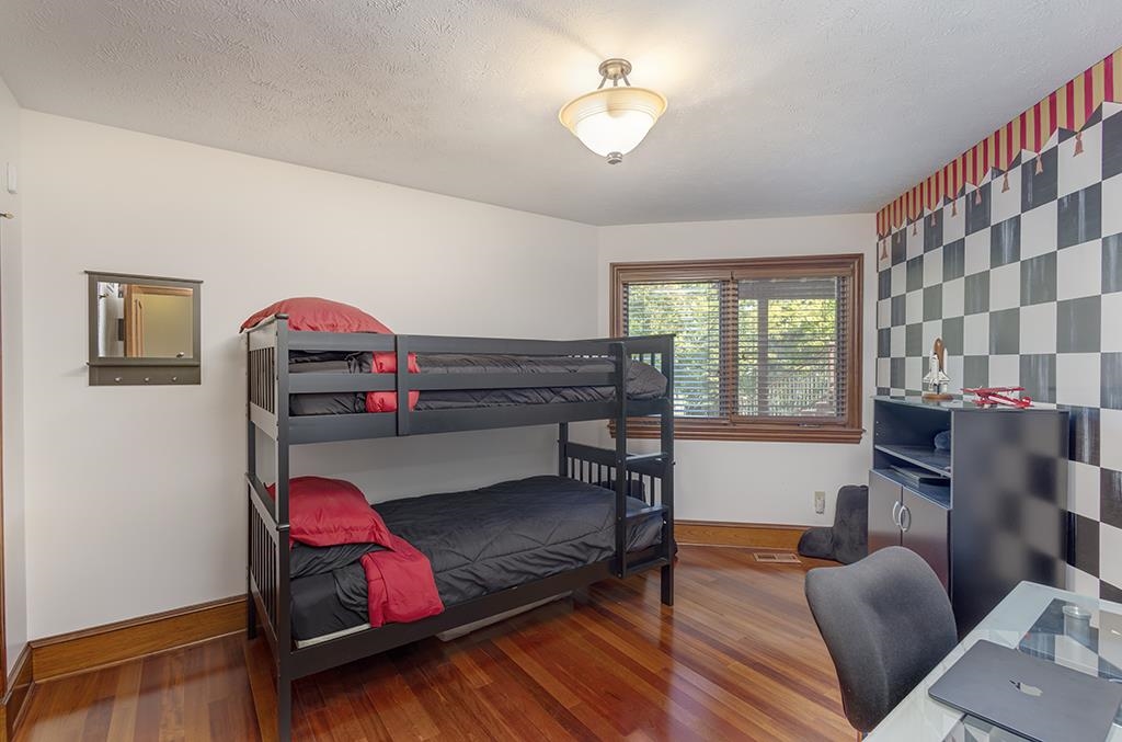 7417 Winding Way Roscoe, IL 61073 - Photo 28 of 40 a bedroom with furniture and a wooden floor