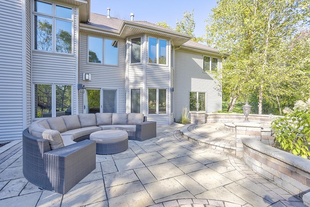 7417 Winding Way Roscoe, IL 61073 - Photo 30 of 40 a view of a patio with couches and a potted plant