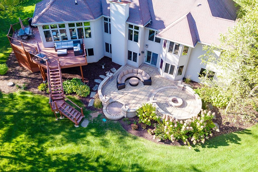 7417 Winding Way Roscoe, IL 61073 - Photo 31 of 40 a aerial view of a house with table and chairs and potted plants