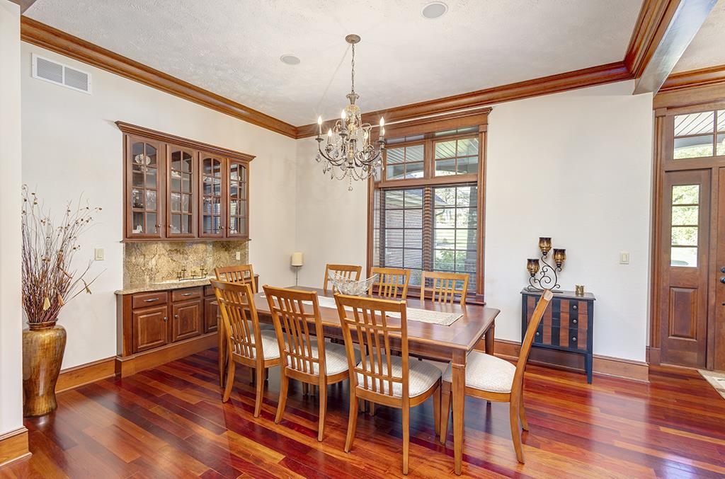 7417 Winding Way Roscoe, IL 61073 - Photo 5 of 40 a view of a dining room with furniture window and wooden floor