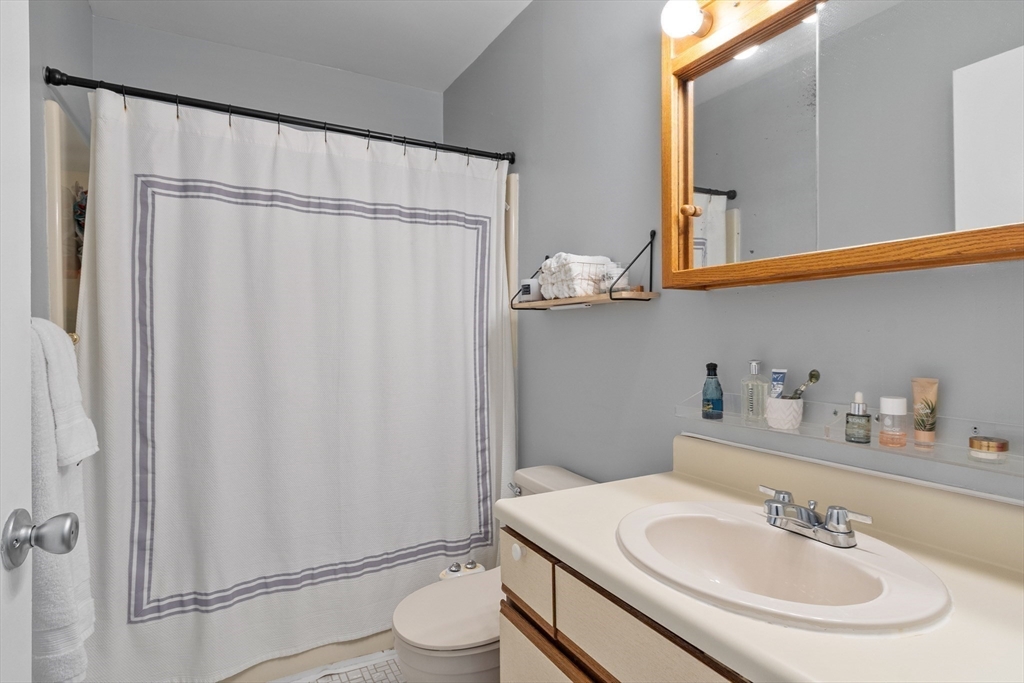 42 Farmland Road, Unit D Lowell, MA 01850 - Photo 13 of 26 a bathroom with a sink toilet and shower
