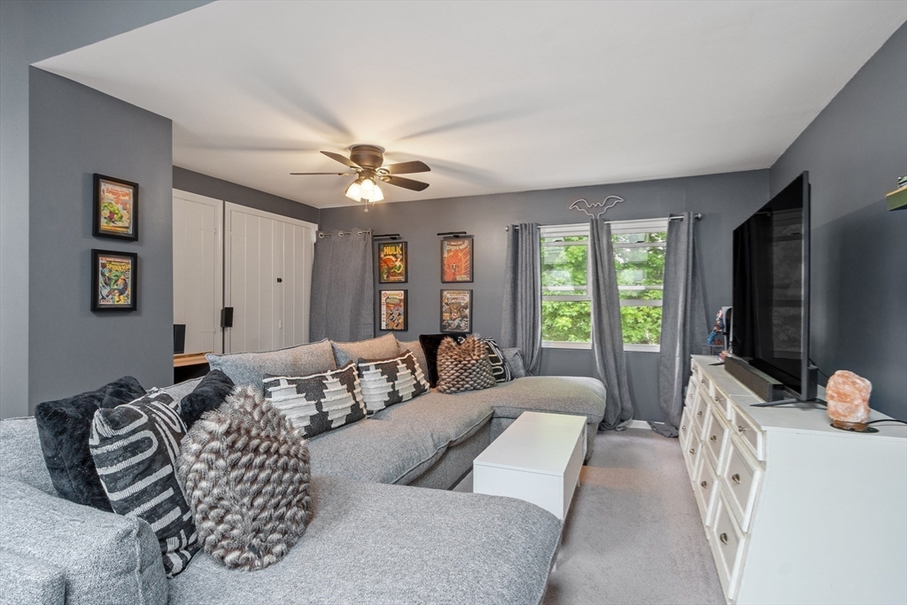 42 Farmland Road, Unit D Lowell, MA 01850 - Photo 17 of 26 a living room with furniture ceiling fan and a window