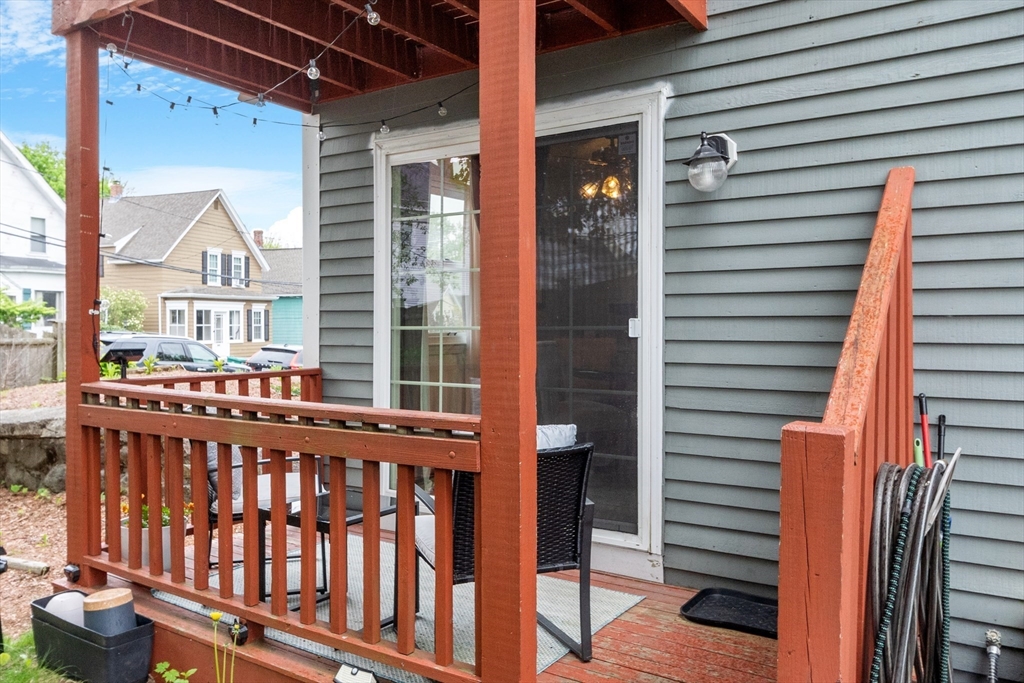 42 Farmland Road, Unit D Lowell, MA 01850 - Photo 21 of 26 a view of a balcony with wooden floor