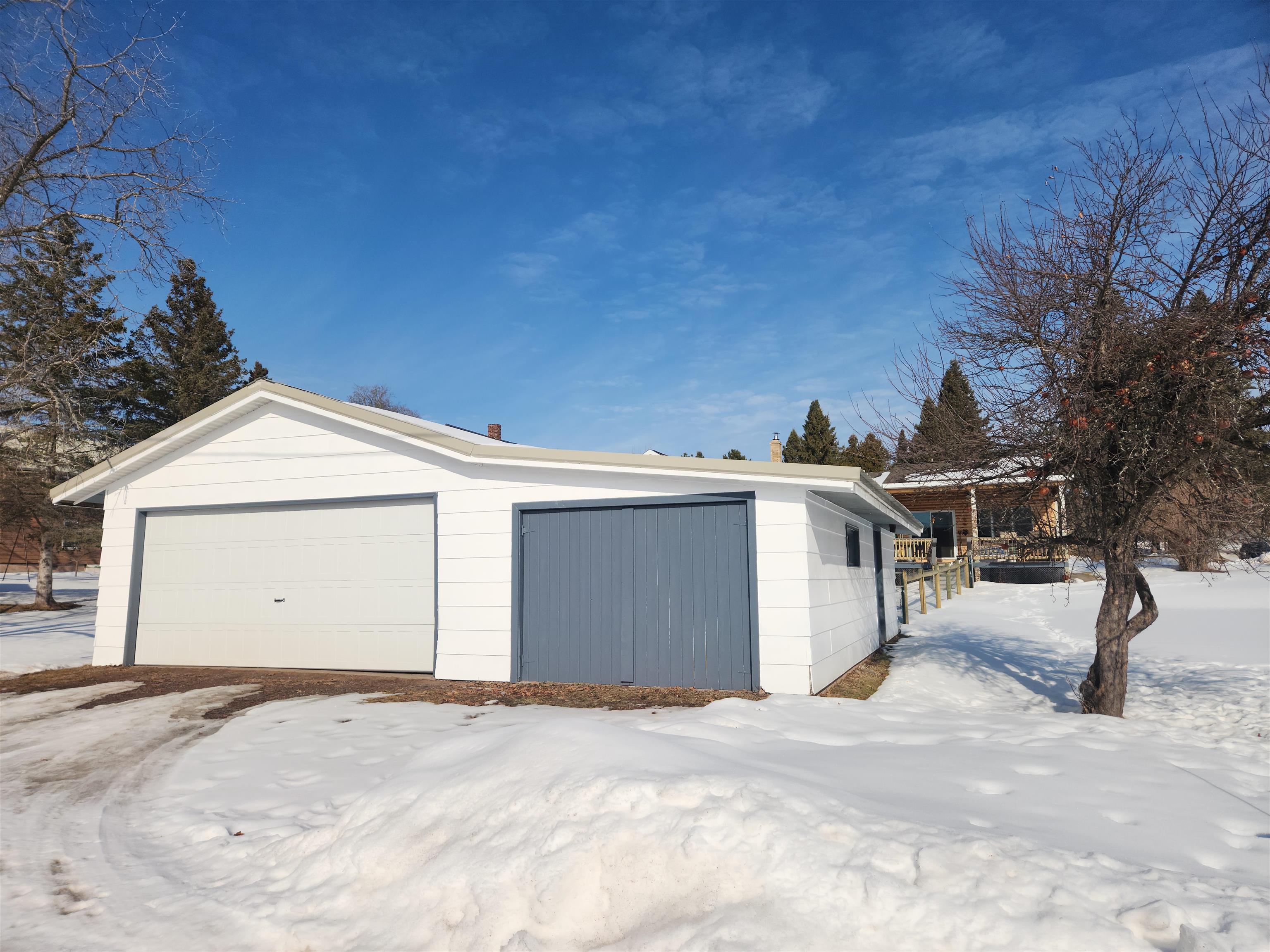 608 West 3rd Street Washburn, WI 54891 - Photo 22 of 26 New garage door and opener, fits two cars, attached to the workshop. Alley side view