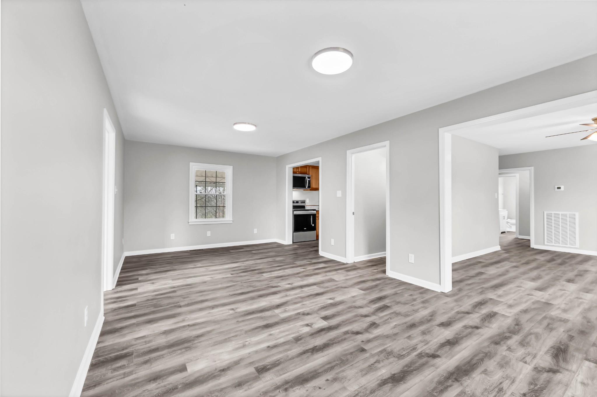 3436 State Highway 48 Cunningham, TN 37052 - Photo 13 of 45 a view of empty room with wooden floor and window