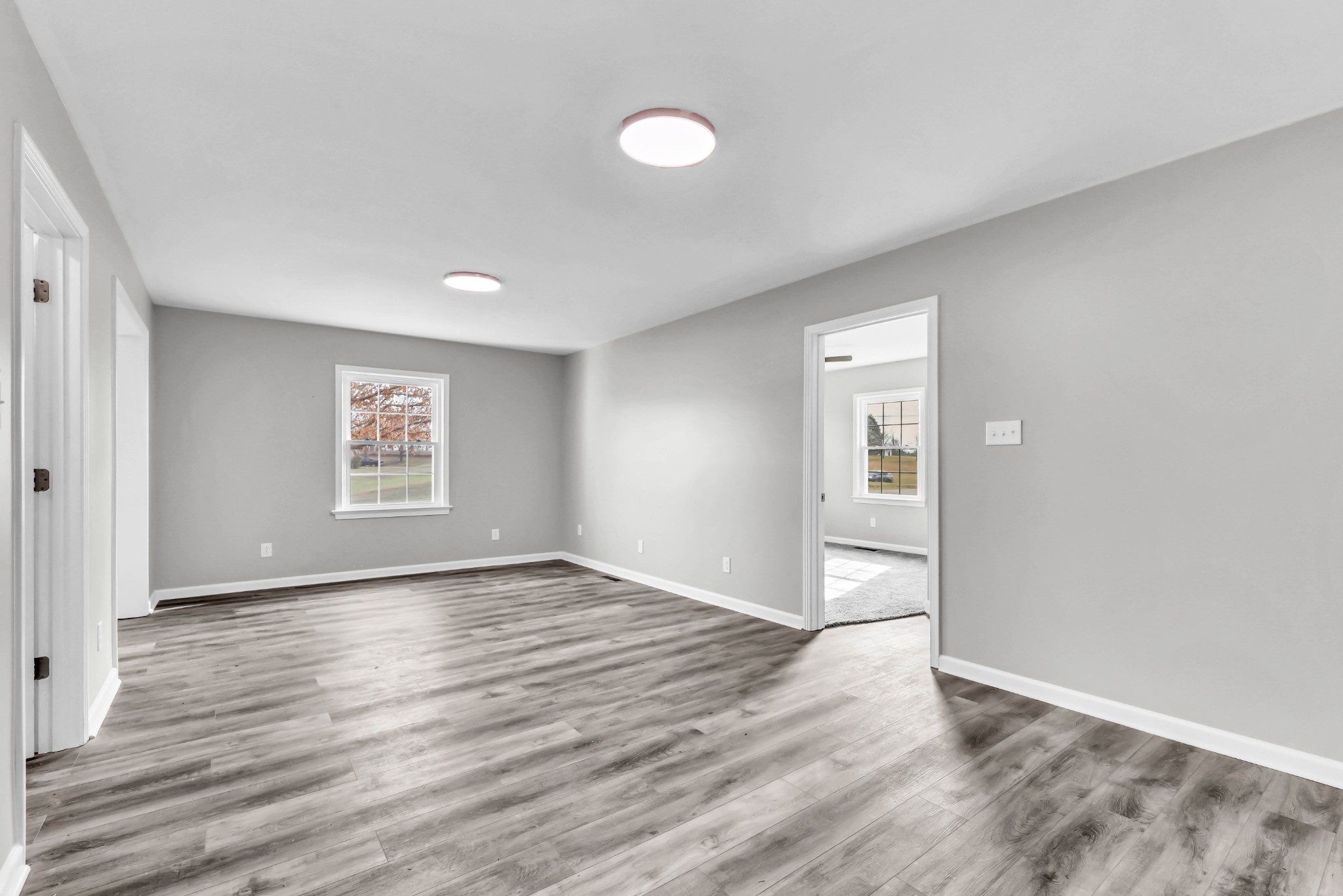 3436 State Highway 48 Cunningham, TN 37052 - Photo 15 of 45 a view of an empty room with wooden floor and a window