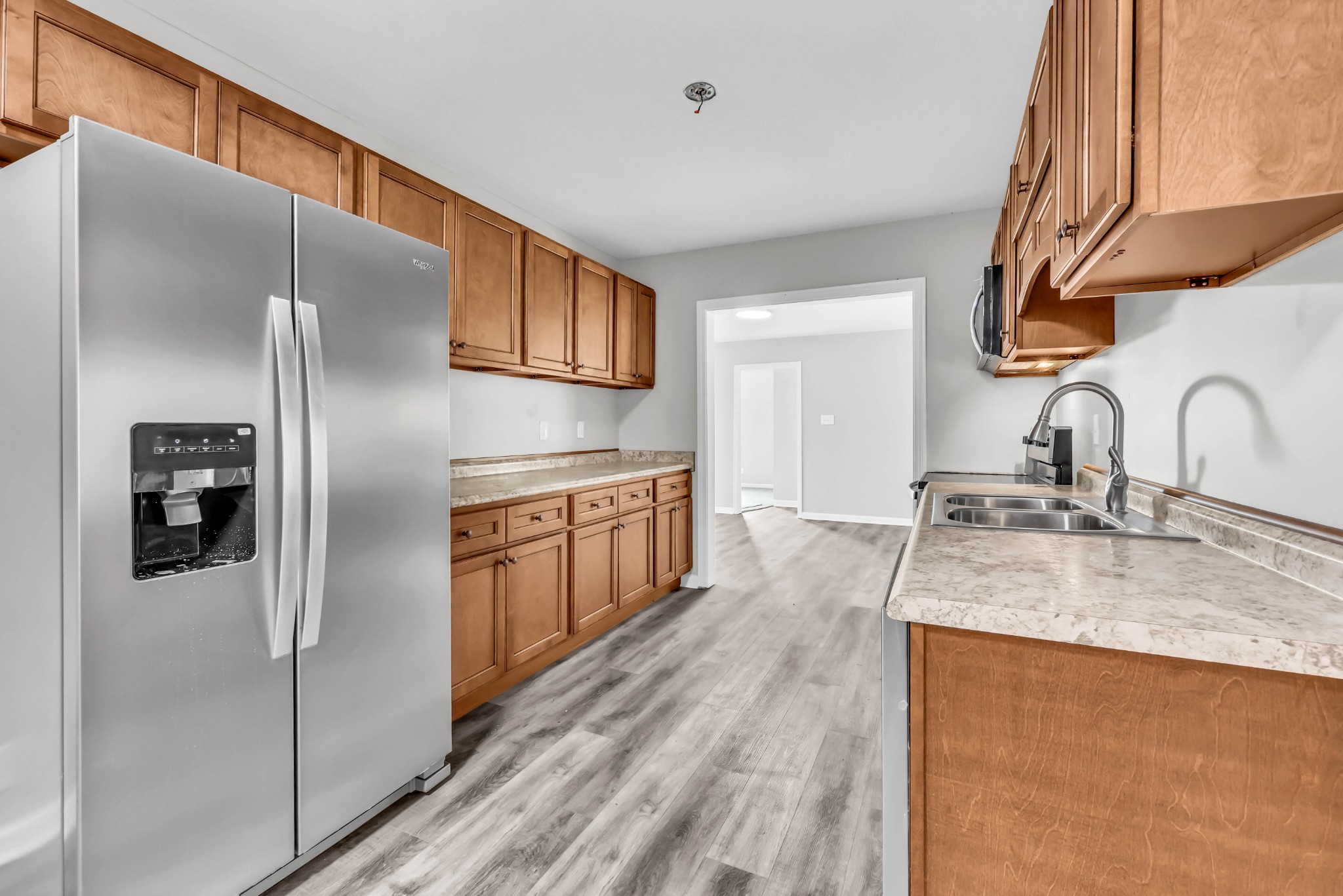 3436 State Highway 48 Cunningham, TN 37052 - Photo 18 of 45 a kitchen with stainless steel appliances granite countertop a refrigerator and a sink