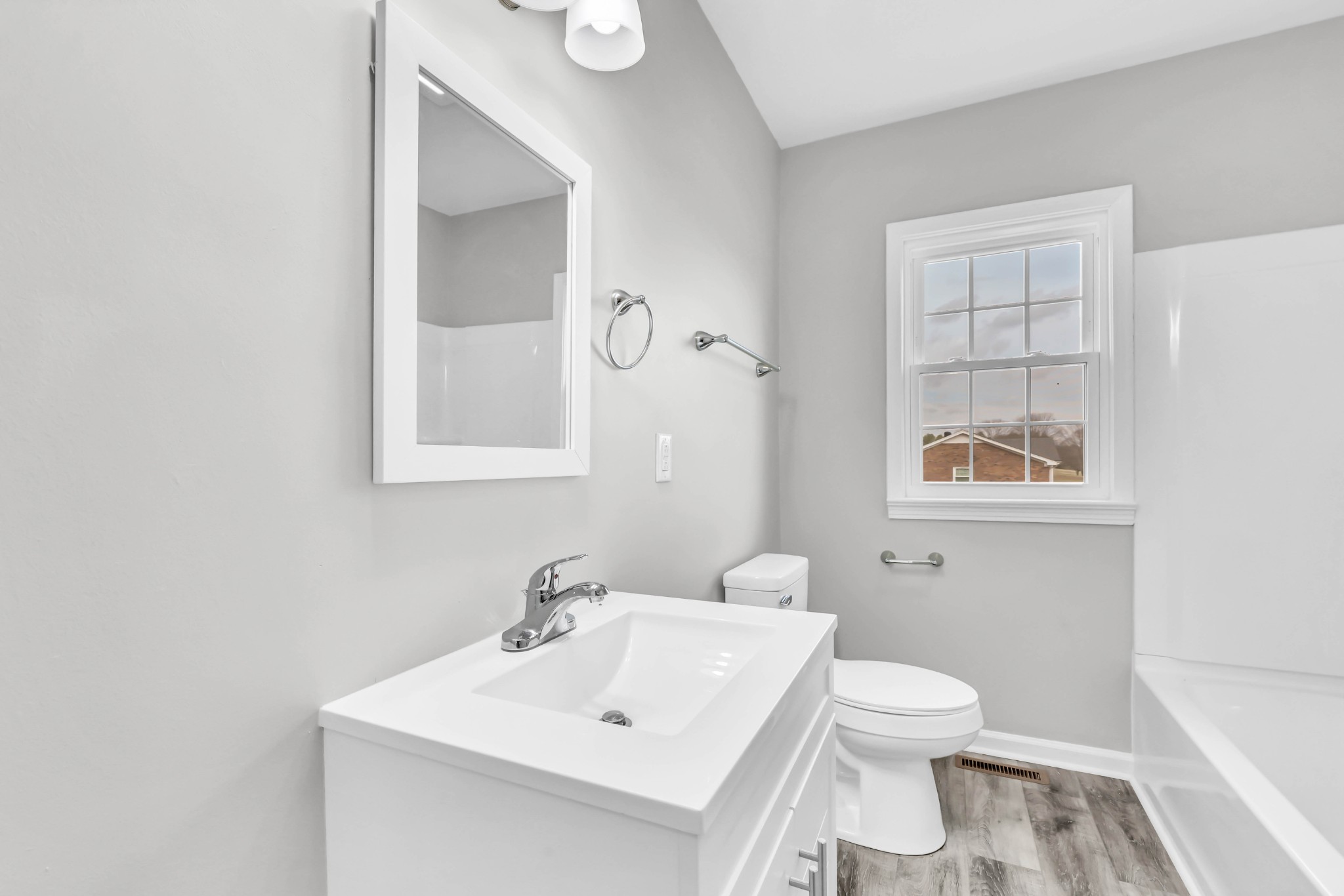 3436 State Highway 48 Cunningham, TN 37052 - Photo 29 of 45 a white toilet sitting next to a bathroom sink