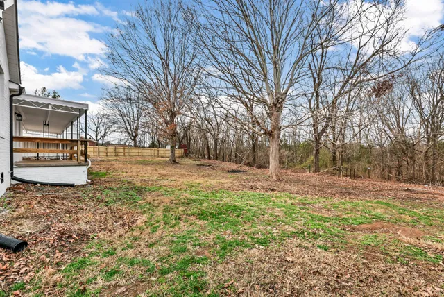 a view of a backyard of the house