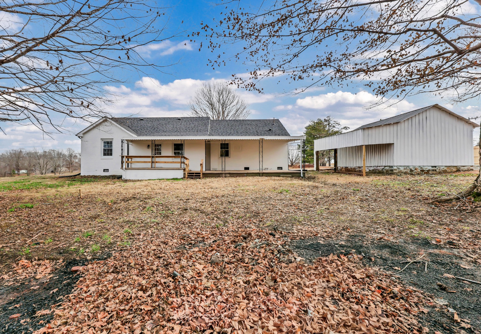 3436 State Highway 48 Cunningham, TN 37052 - Photo 43 of 45 a front view of a house with a yard