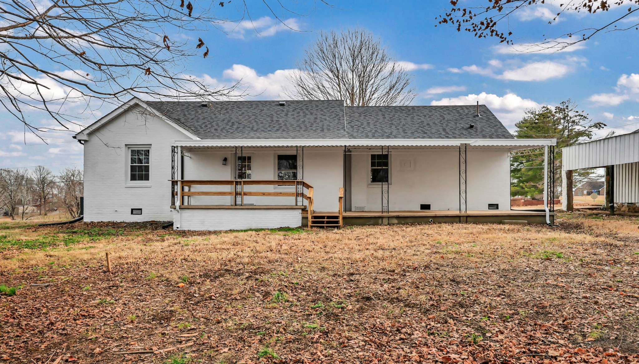 3436 State Highway 48 Cunningham, TN 37052 - Photo 44 of 45 a house with trees in the background