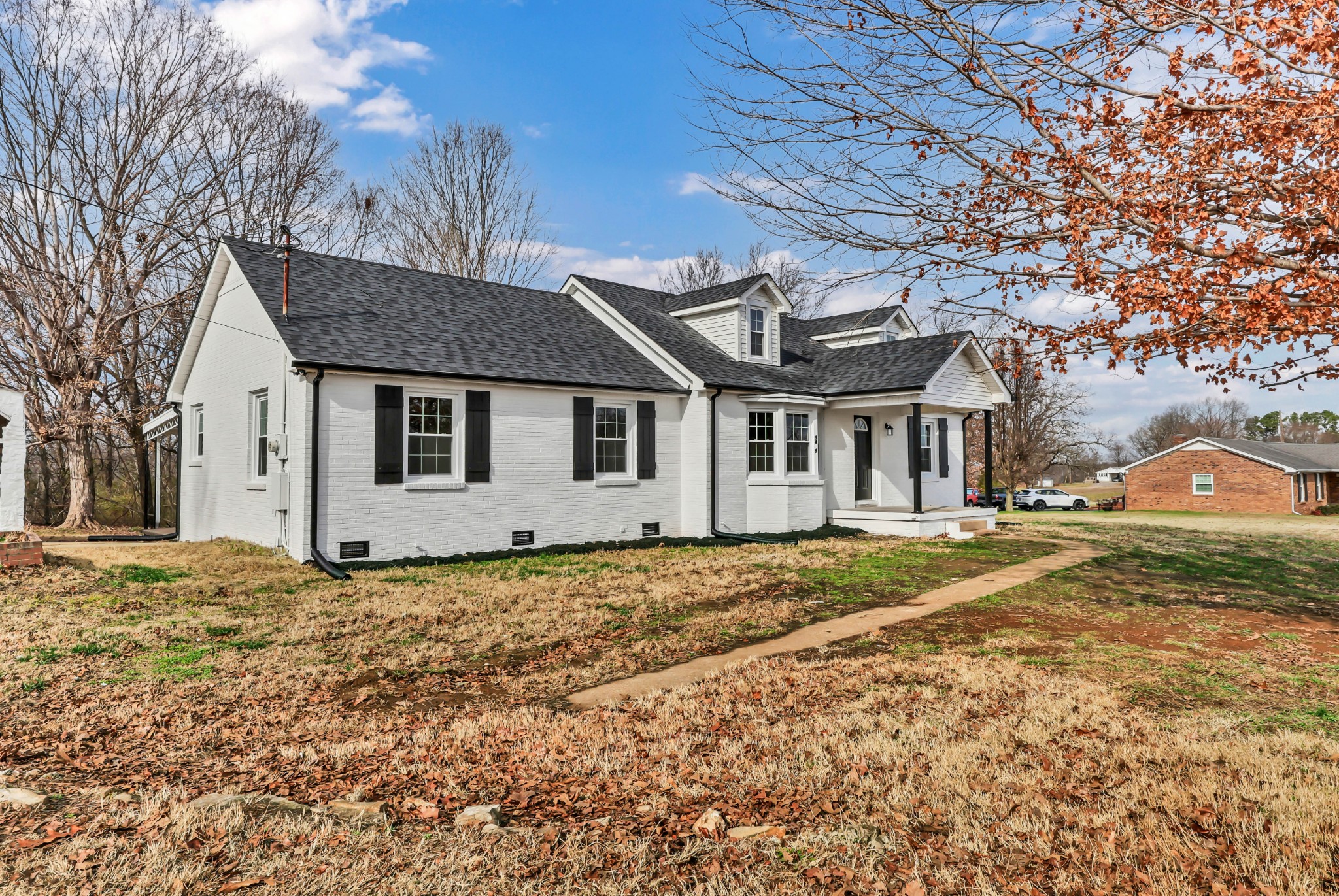 3436 State Highway 48 Cunningham, TN 37052 - Photo 5 of 45 a front view of a house with a yard