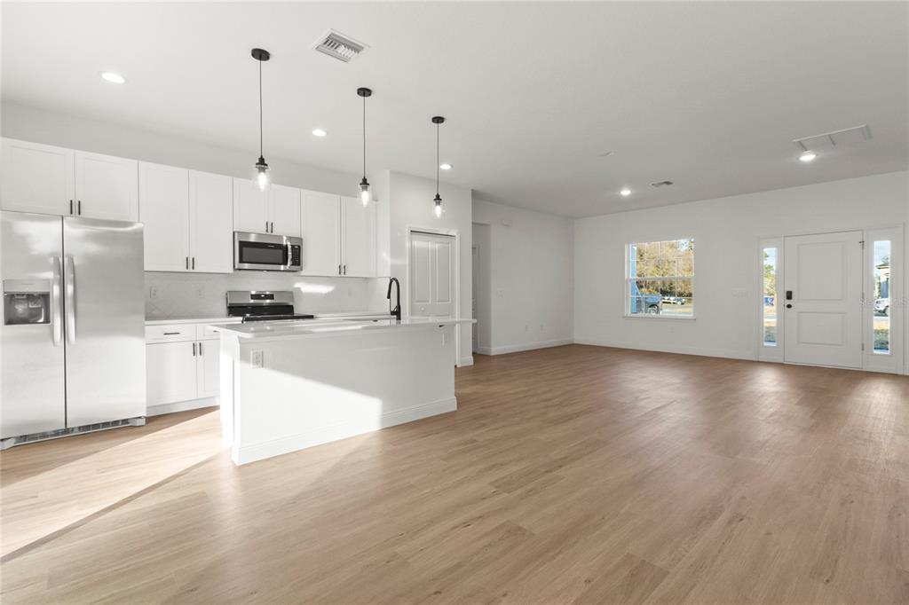 5534 Southwest 152nd Lane Road Ocala, FL 34473 - Photo 6 of 19 a view of a kitchen with a sink and a stove top oven