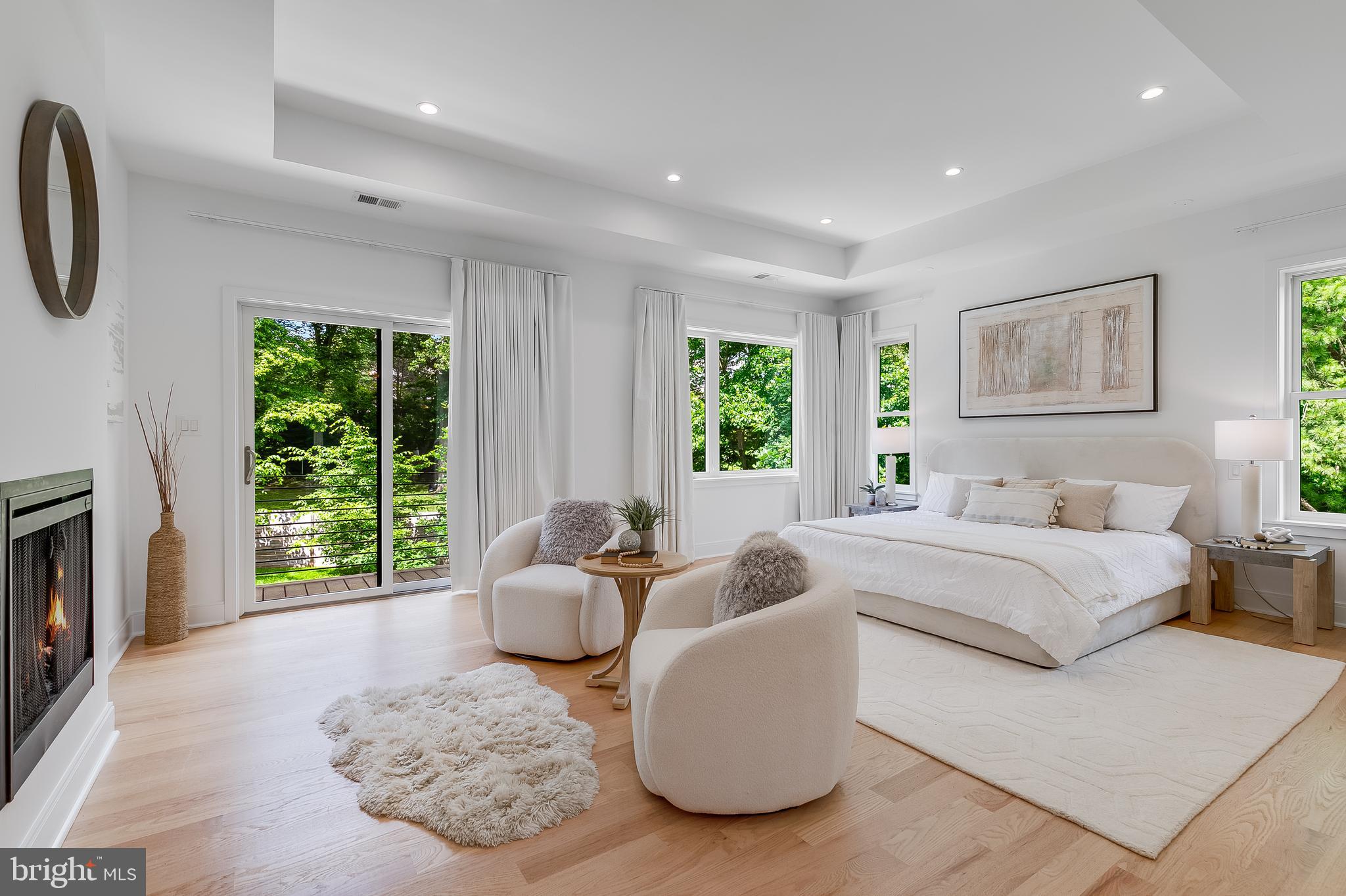 5914 Woodley Road McLean, VA 22101 - Photo 28 of 69 a spacious bedroom with a large bed and a window