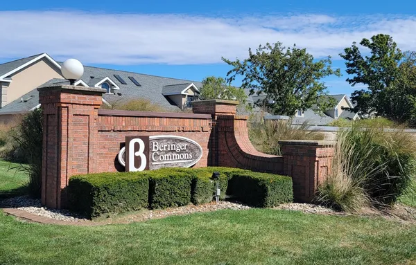 a view of outdoor space with sign board and garden