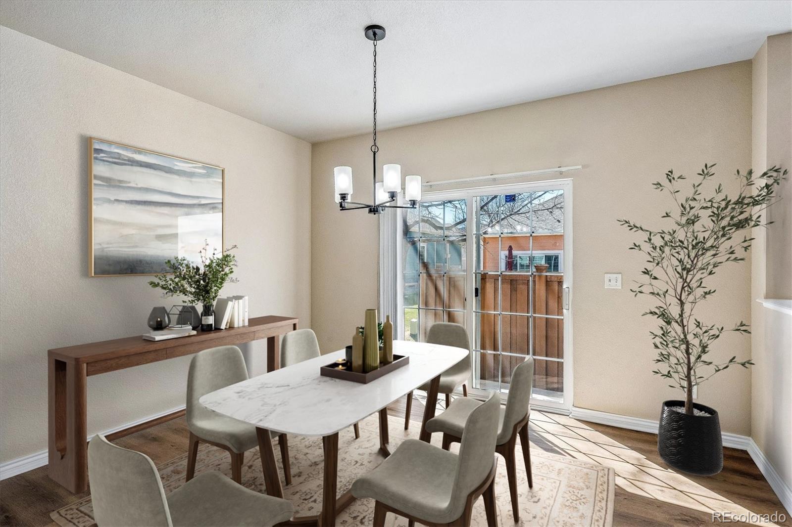 4545 South Taft Way Morrison, CO 80465 - Photo 4 of 24 a view of a dining room with furniture and wooden floor