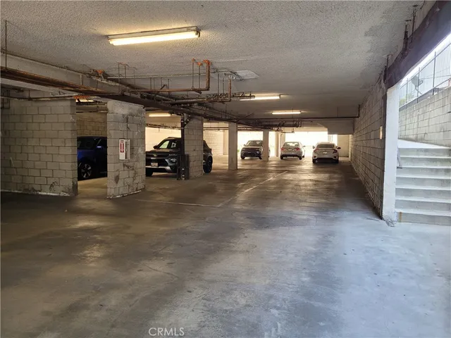 a living room with furniture and wall painting