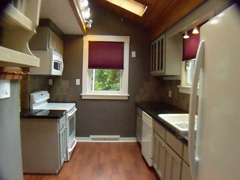 326 Castlegate Road Forest Hills, PA 15221 - Photo 12 of 25 Kitchen. Nice bright kitchen with sky lights and view of side yard. Newer cabinets with granite tile counter tops and tiled back splash