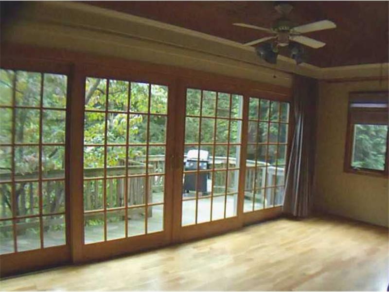 326 Castlegate Road Forest Hills, PA 15221 - Photo 13 of 25 Family Room. This room with a wall of windows leads to the back deck and yard. Perfect to enjoy the serene outdoor space