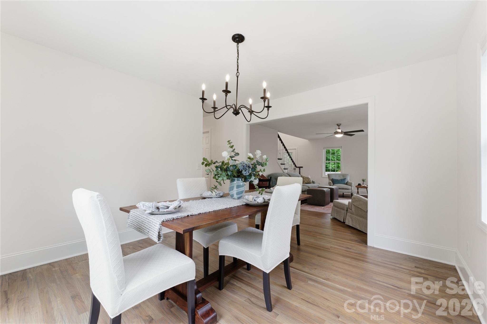 15 Raccoon Point Canton, NC 28716 - Photo 15 of 48 a view of a dining room with furniture and wooden floor