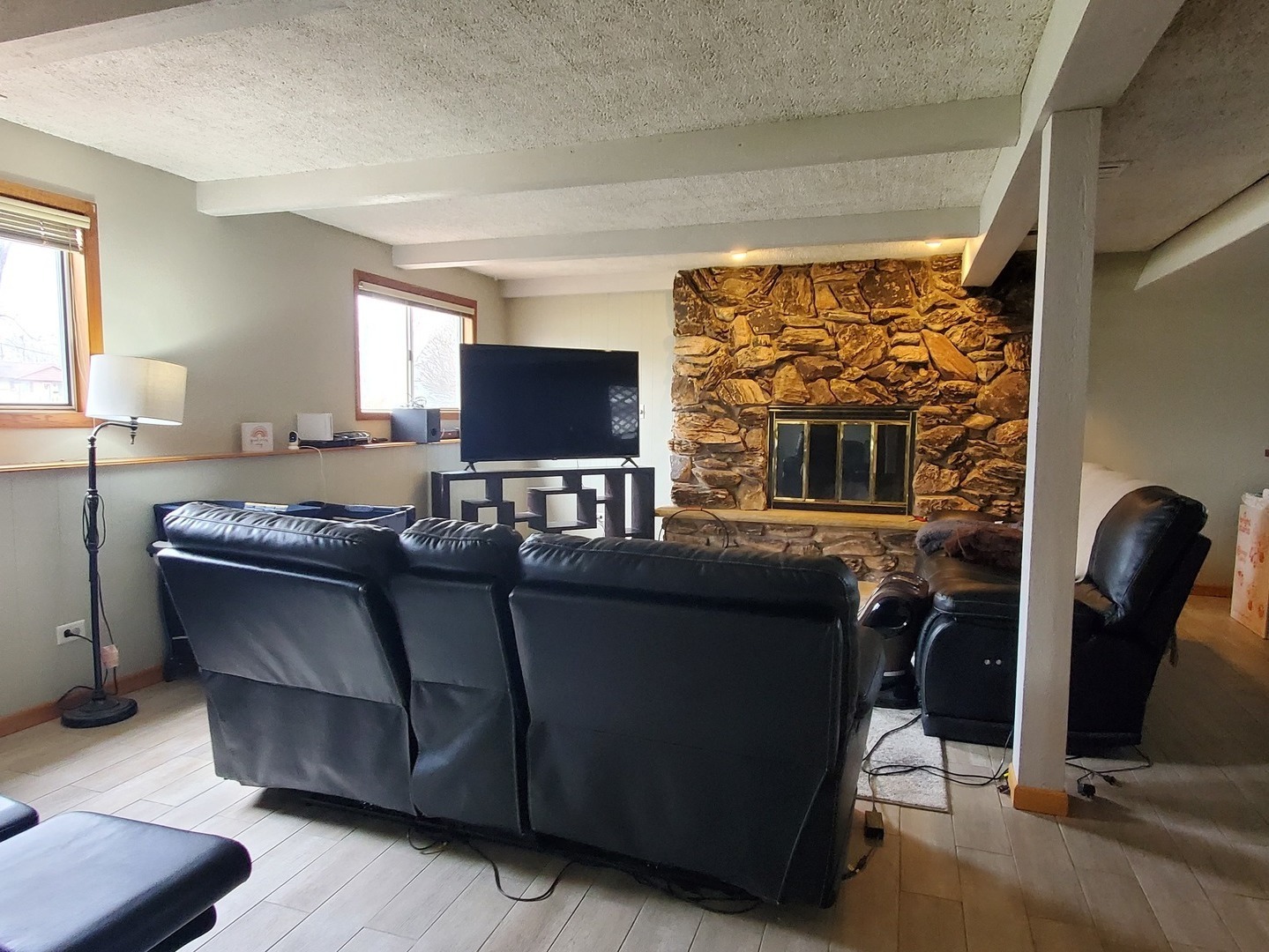 153 Fletcher Drive Wheeling, IL 60090 - Photo 14 of 22 a living room with furniture and a flat screen tv