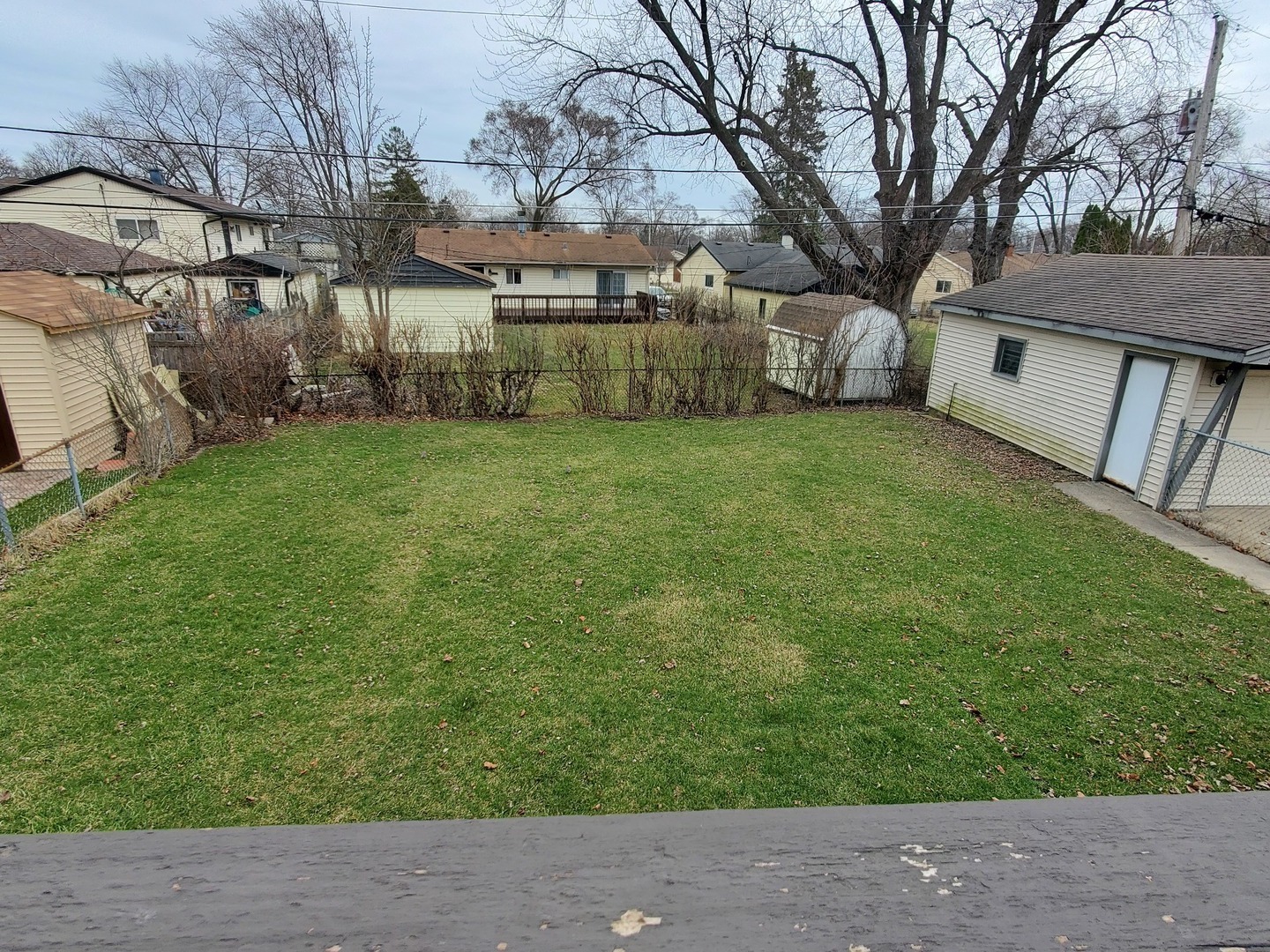 153 Fletcher Drive Wheeling, IL 60090 - Photo 17 of 22 a backyard of a house with table and chairs