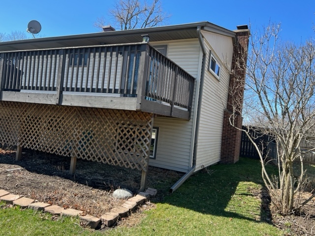 153 Fletcher Drive Wheeling, IL 60090 - Photo 19 of 22 a view of a house with a wooden deck