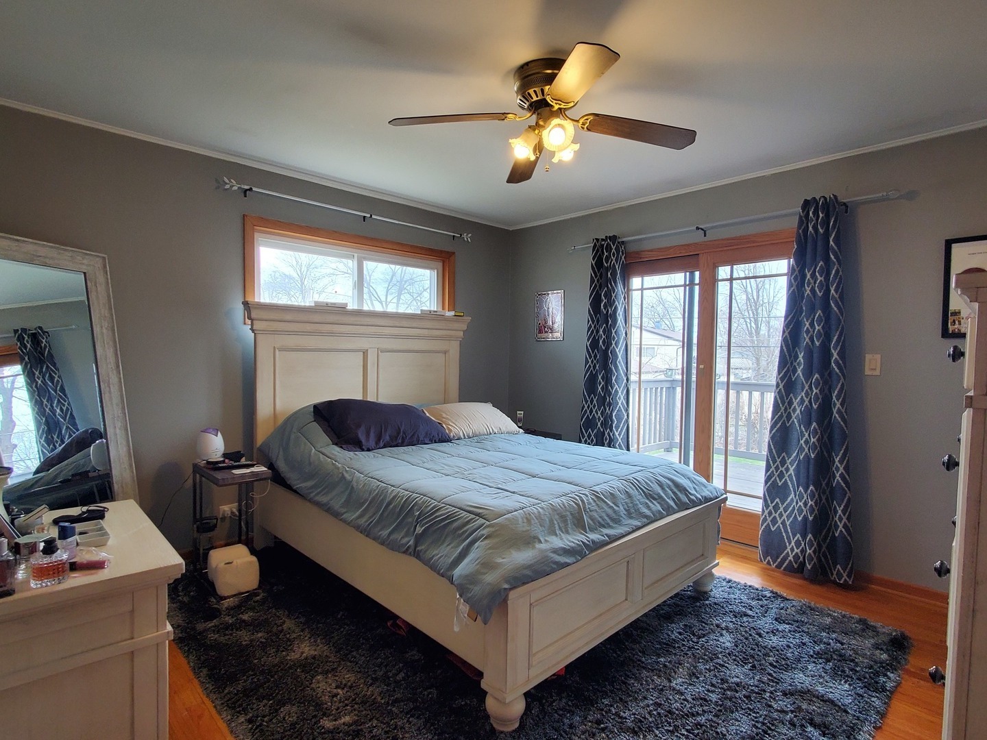153 Fletcher Drive Wheeling, IL 60090 - Photo 7 of 22 a bedroom with a bed and a chandelier