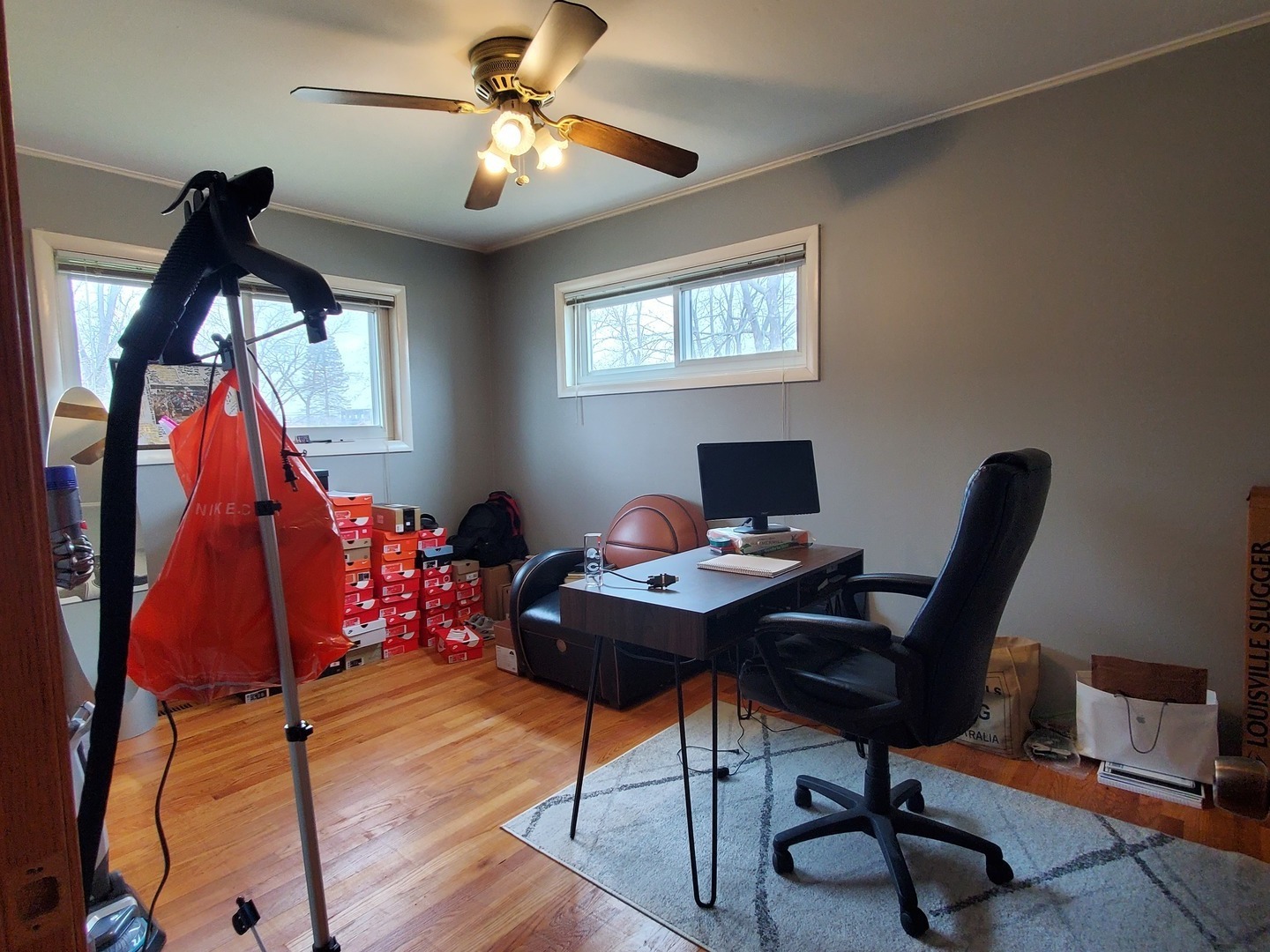 153 Fletcher Drive Wheeling, IL 60090 - Photo 8 of 22 a view of a workspace with furniture and a window