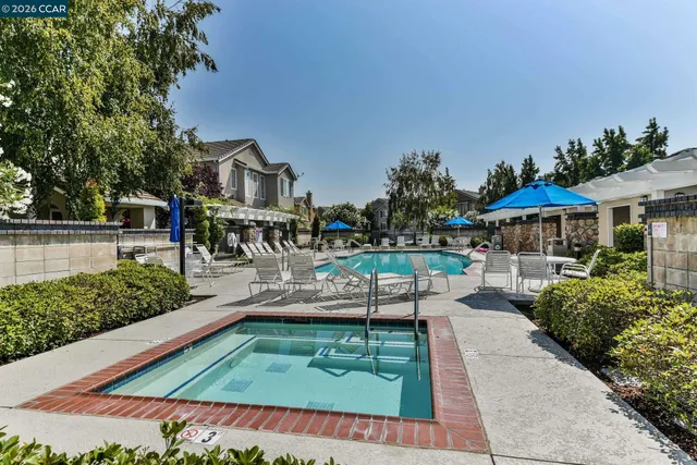 a view of a swimming pool with a patio